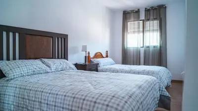 Cama o camas de una habitación en La Suerte Apartamento rural