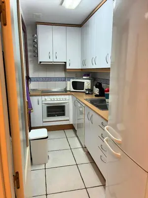 Una cocina o zona de cocina en Mediterranea 20 Vera Playa Jardines tus momentos frente al mar