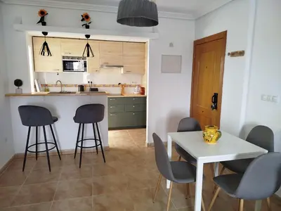 Una cocina o zona de cocina en Appartement avec Piscine et Parking