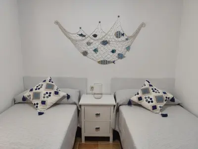 Cama o camas de una habitación en Apartamento Vera playa, Entre Sol y Salinas