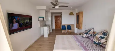 Una televisión o centro de entretenimiento en Levante 24 Estudio Naturista primera línea