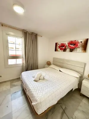 Cama o camas de una habitación en Expoholidays - Coqueto apartamento Puerto Deportivo