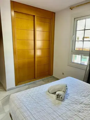 Cama o camas de una habitación en Expoholidays - Coqueto apartamento Puerto Deportivo