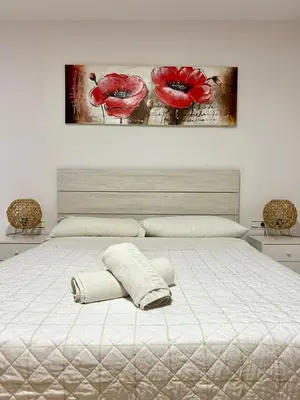 Cama o camas de una habitación en Expoholidays - Coqueto apartamento Puerto Deportivo