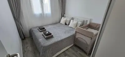 Cama o camas de una habitación en Apartamentos playa Romanilla