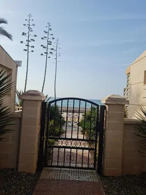 Un balcón o terraza de Vacaciones en Primera Linea de Playa