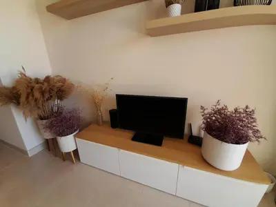 Una televisión o centro de entretenimiento en Apartamento cómodo en Pulpi con WiFi y vista al golf, cerca de la playa - ES-376-29