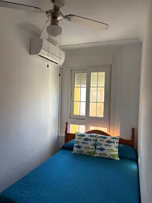Cama o camas de una habitación en Apartamentos La Almadraba 1-5