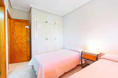 Cama o camas de una habitación en Apartamento con Terraza, Piscina y Parking By Aloha Palma