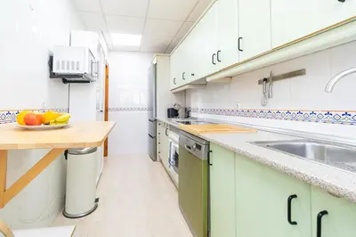 Una cocina o zona de cocina en Apartamento con Terraza, Piscina y Parking By Aloha Palma