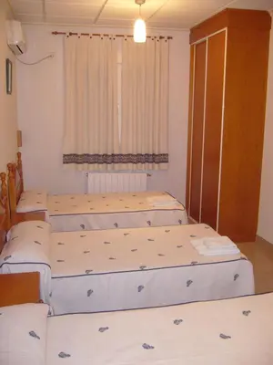 Cama o camas de una habitación en Hostal Casa Grande