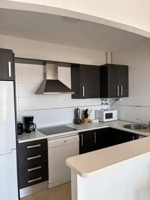 Una cocina o zona de cocina en Precioso apartamento con vistas al mar
