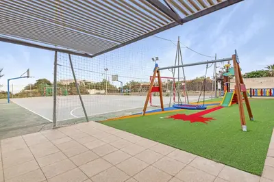 Zona de juegos infantil en Blue Nest I Private Pool I BBQ I AC I Terrace