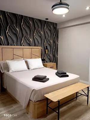 Cama o camas de una habitación en Vivienda Premium Estación- Nidos