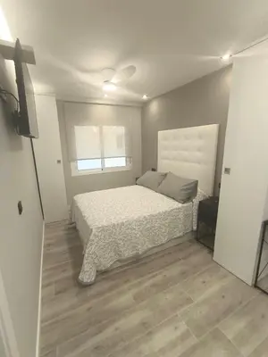 Cama o camas de una habitación en Vivienda premiun estación Nido 2