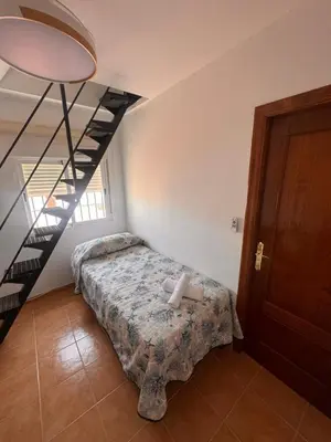 Cama o camas de una habitación en Casa de playa mediterránea, a metros de la playa