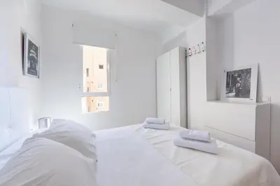 Cama o camas de una habitación en AlmeriaSuite Las Caracolas Beach