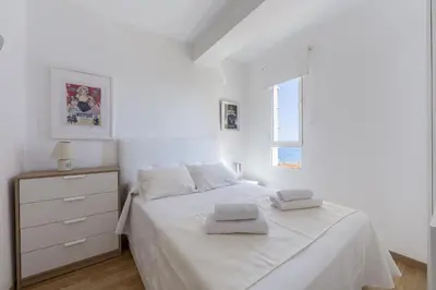 Cama o camas de una habitación en AlmeriaSuite Las Caracolas Beach