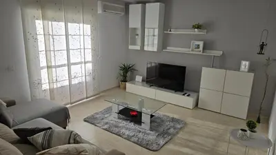 Una televisión o centro de entretenimiento en Casa Puerta Roquetas