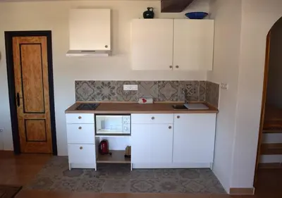 Una cocina o zona de cocina en Gran Terraza San Jose Apartment