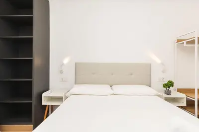 Cama o camas de una habitación en El Cable Apartament- A estrenar, apartamento céntrico y cerca de la playa