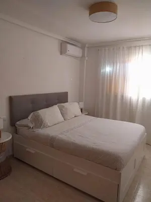 Cama o camas de una habitación en Ático con vistas al mar