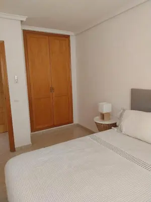 Cama o camas de una habitación en Ático con vistas al mar