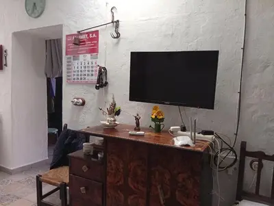Una televisión o centro de entretenimiento en Villa CHELO