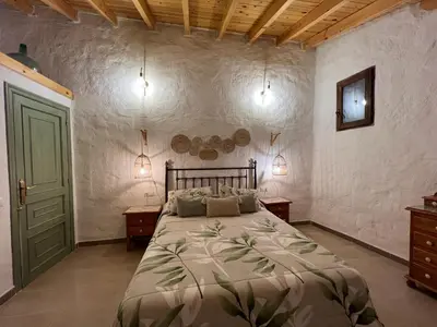 Cama o camas de una habitación en Casa -Cueva Paraje De Los Majuelos
