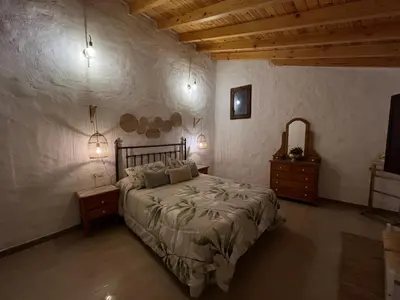 Cama o camas de una habitación en Casa -Cueva Paraje De Los Majuelos