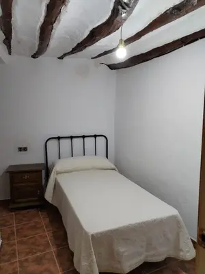 Cama o camas de una habitación en Apartamento rural Zújar
