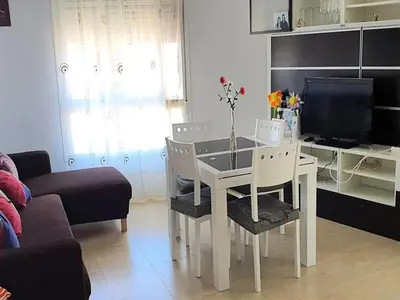 Una televisión o centro de entretenimiento en Apartment in Roquetas near the beach