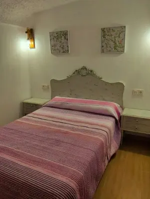 Cama o camas de una habitación en Casa-cueva 'MI ABUELA L O L A'