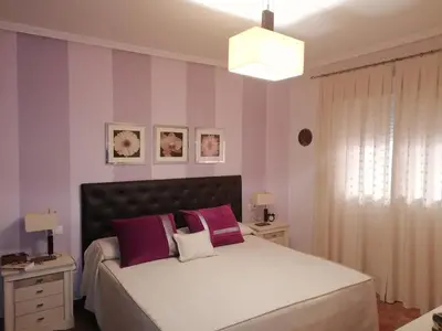 Cama o camas de una habitación en Vera Playa, apartamento exclusivo frente a la playa