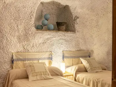 Cama o camas de una habitación en Holiday Home Cueva Mariana Pineda by Interhome