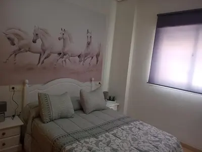 Cama o camas de una habitación en Apartamento en roquetas de mar