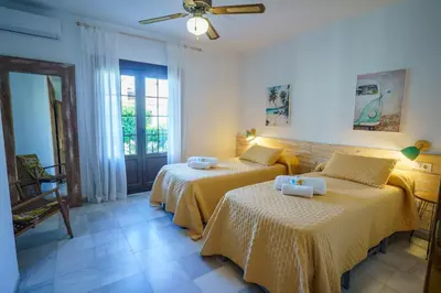 Cama o camas de una habitación en Vera Brisa-Adosado frente al mar