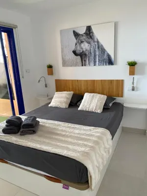 Cama o camas de una habitación en Casa con vista al mar