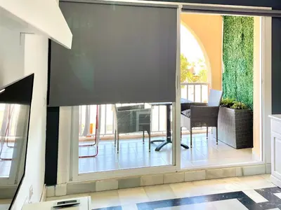 Una televisión o centro de entretenimiento en Apartment in Roquetas near Playa Serena