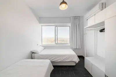 Cama o camas de una habitación en LUXURY HOMEs MOJACAR PUEBLO WITH PANORAMIC VIEWS A POOL JACUZZI AND ROOFTOP GYM