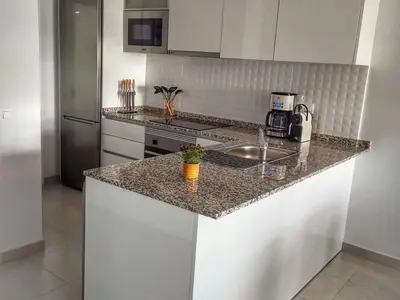 Una cocina o zona de cocina en Apartamento moderno con piscina, a 500m de la playa, San Juan de los Terreros - ES-376-41