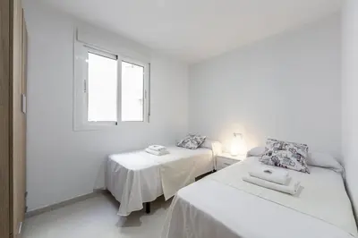 Cama o camas de una habitación en AlmeriaSuite Sabinar Beach