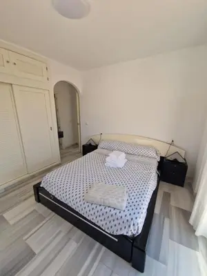 Cama o camas de una habitación en Bonito ático con vistas al mar