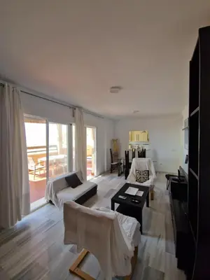 Cama o camas de una habitación en Bonito ático con vistas al mar