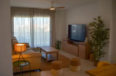Una televisión o centro de entretenimiento en TrendyHomes Almerimar Beach II, residencial de lujo en primera línea de playa