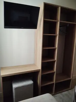 Una televisión o centro de entretenimiento en Hotel Vélez