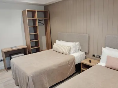 Cama o camas de una habitación en Hotel Vélez