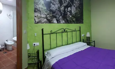 Cama o camas de una habitación en Casa Rural ENTRESIERRAS