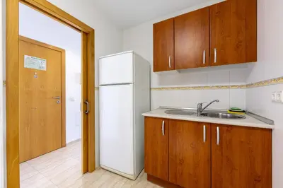 Una cocina o zona de cocina en AlmeriaSuite Palm Beach Apartments