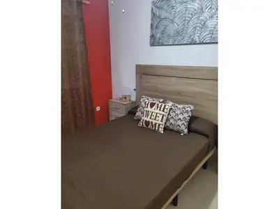 Cama o camas de una habitación en Cozy townhouse in Vera, just steps from the beach